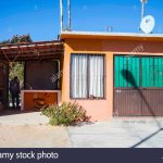 Old Typical Mexican Orange House With Iron Gates. Blue Sky, Sunny   Baja California Real Estate Map